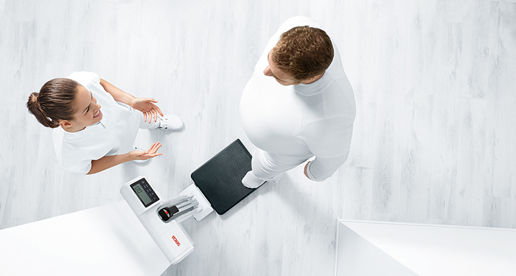 Seca 787 EMR-validated column scale with eye-level display, handrail-compatible